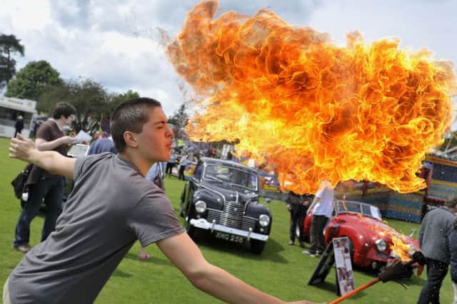 Young fire eater Andy Edgar at a previous carnival