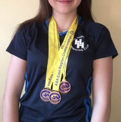 Alice Fender with her full compliment of medals