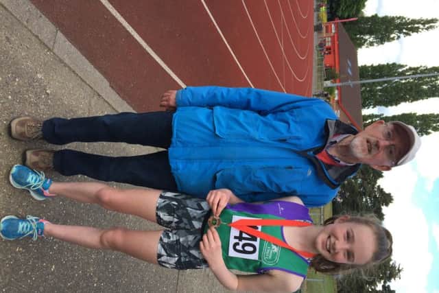 Dacorum & Tring coach Mike Dunphy, one of the top coaches for young athletes in the country, with Olivia Edwards, winner of the county bronze in the U13 girls 1500m.