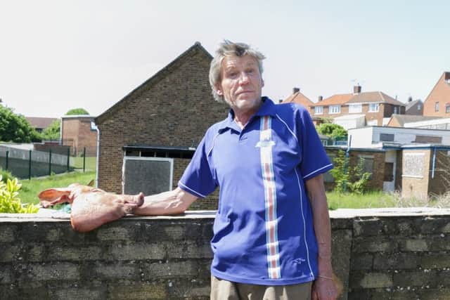 Resident John Hall removed the head from outside the building