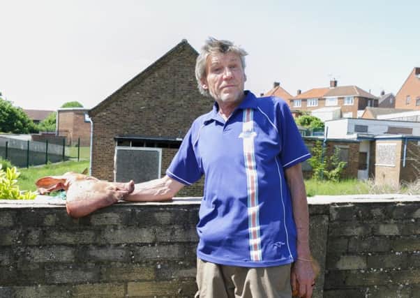 Resident John Hall removed the head from outside the building