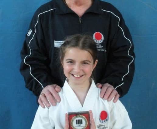 Proud SSKI chief instructor Malcolm Phipps with his young protÃ©gÃ©, Crystal Close