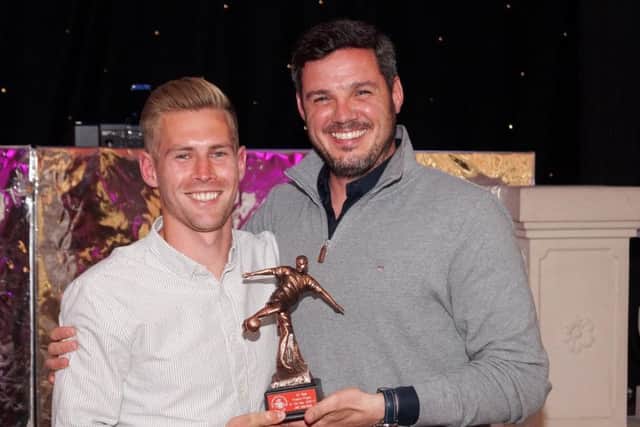 Tudors skipper Jordan Parkes collects the players player of the year trophy from Hemel boss Dean Brennan, on behalf of former Town striker Jake Robinson