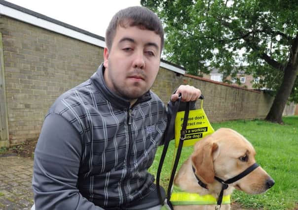 Colin Perreira and his guide dog who had problems with a Uber taxi.