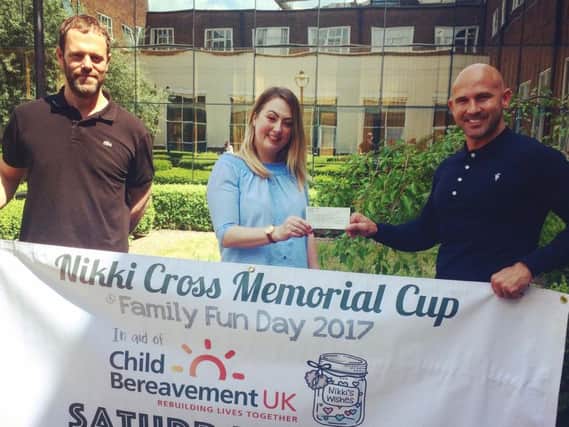 A cheque is presented to CB UK on behalf of Nikki's Wishes