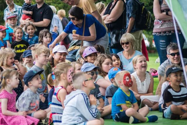 Children enjoy the Punch and Judy show. Picture by JGEPhotography