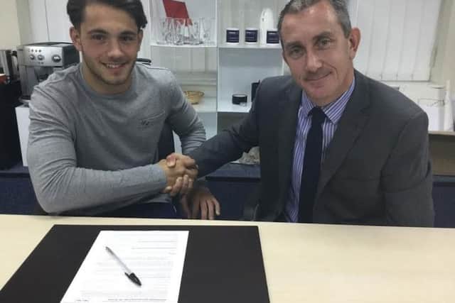 Sam Tring with Kings Langley chairman Jeremy Wilkins after signing a two-year contract