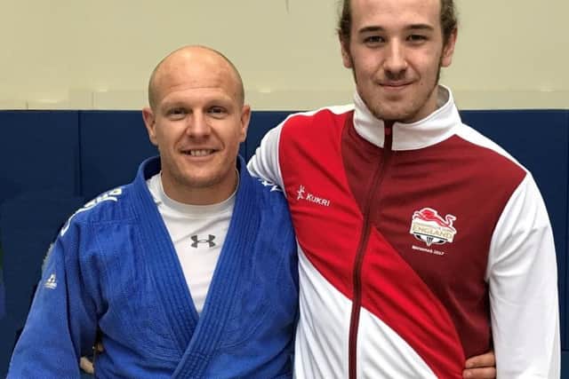 Tom Lish, right, with Rush Judo coach Laurie Rush