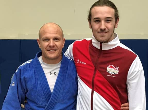 Tom Lish, right, with Rush Judo coach Laurie Rush