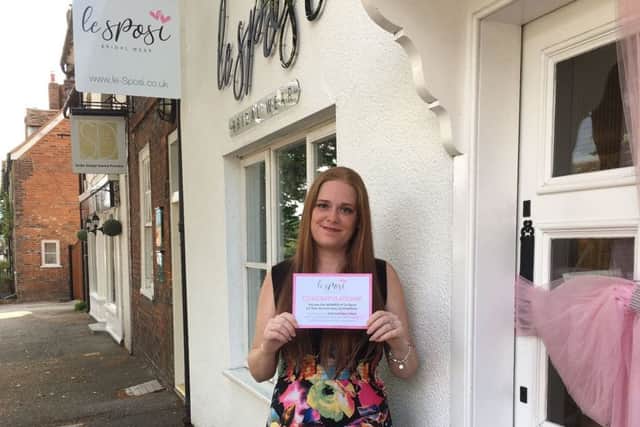 Kerry Hogg is all smiles as she visits Le Sposi on Wendover High Street to collect her prize