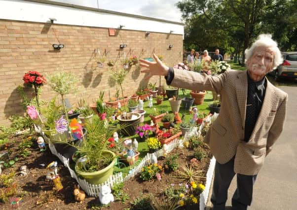 Winston Abela, aged 74, with his garden and some of his friends in Hemel Hempstead