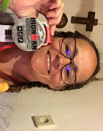 Shires Triers athlete Beth Timlett with her Ironman Austria medal