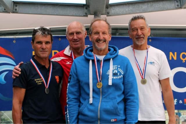 Mike Foskett, third from the left, during the medal ceremony in France