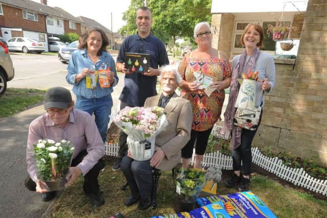 Winston with just some of the people who donated to help him with the upkeep of his garden