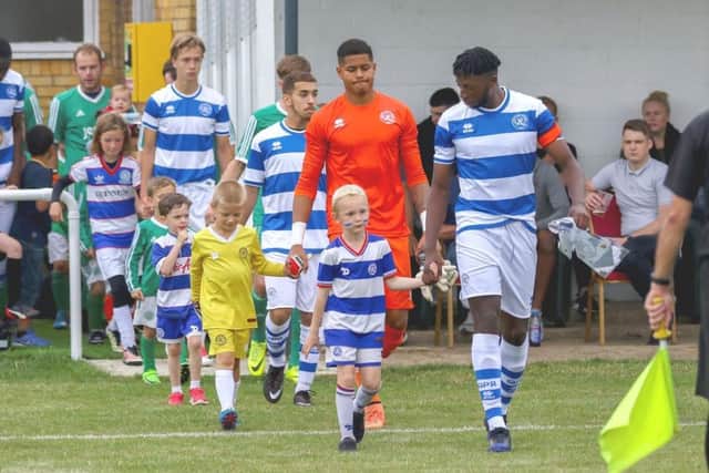 Mascots with the QPR under-23s players before the clash with Bovingdon
