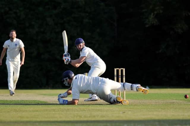 An Abbotts Langley batsman gets the ball past the Kings wicket keeper