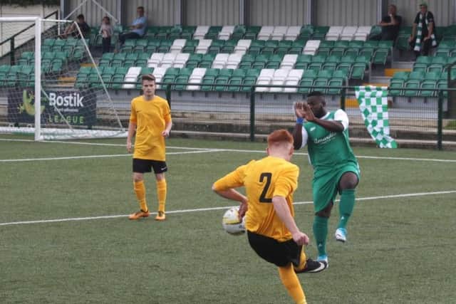 Zak Howells crosses the ball for Leverstock Green against Edgware