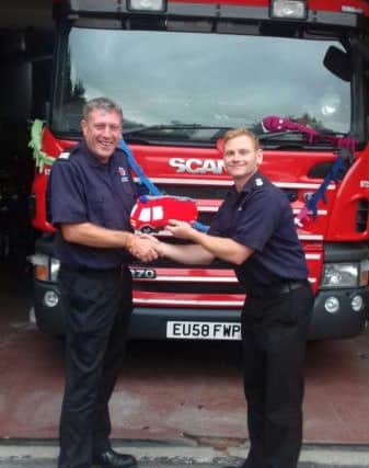 Kings Langley Fire Station receive a wooly gift. In the pic: Barry and Matt