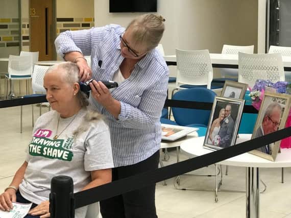 Sally Marshall has her head shaved at The Forum
