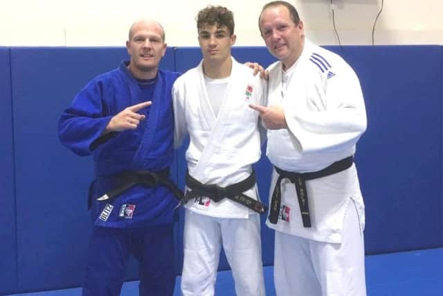Michael Fryer with coaches Laurie Rush and Pete Brent