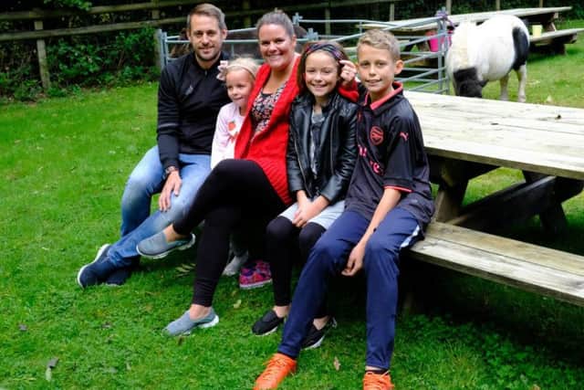 Freya Creaser (second from right) with her family, including parents Lisa and Ian, at the charity fun day