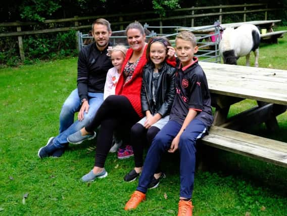 Freya Creaser (second from right) with her family, including parents Lisa and Ian, at the charity fun day