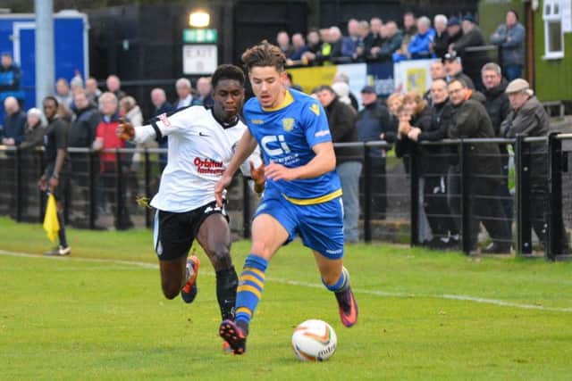 Kings Langley's Brendan Ocran, left, in action against Basingstoke earlier this season.